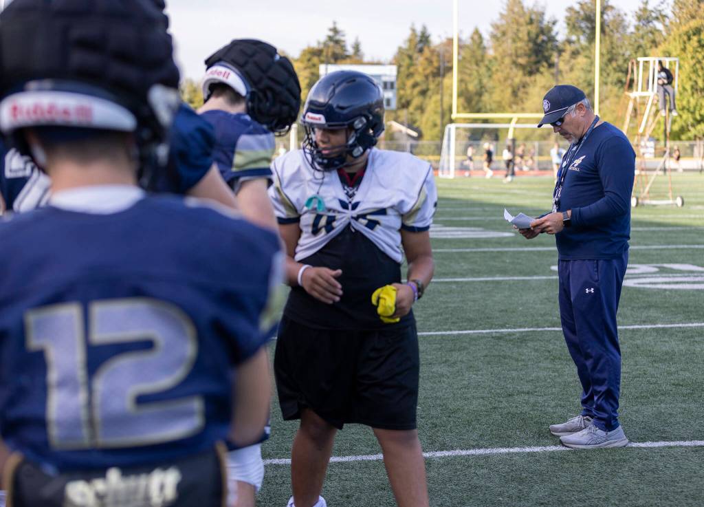 Arlington head coach Greg Dailer runs practice on Oct. 8, 2025 in Arlington, Washington. (Olivia Vanni / The Herald)