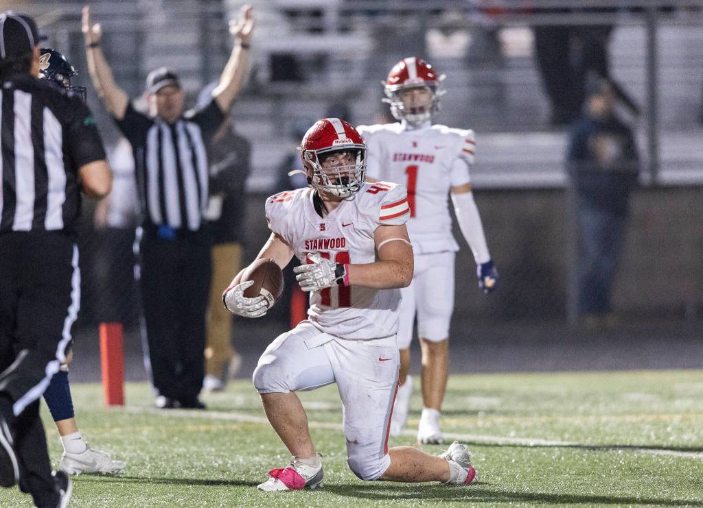 Stanwoods Silas Turpin reacts to scoring a touchdown during the game against Arlington on Oct. 10, 2025 in Arlington, Washington. (Olivia Vanni / The Herald)