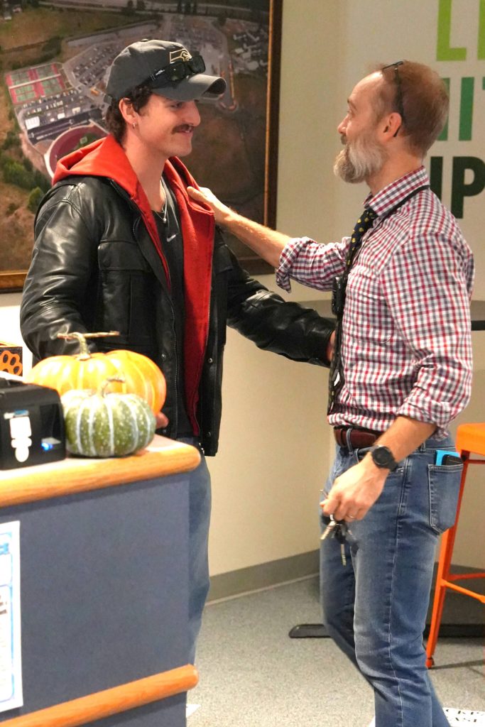 Pop star Benson Boone, left, with Seth Krufka, Monroe High School English teacher, on Monday in Monroe. (Monroe School District)