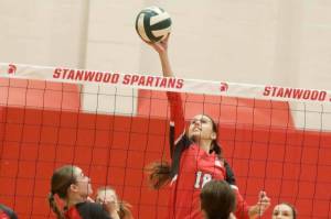 Stanwood outside hitter Whitney Longspaugh tips the ball during a District 1 3A quarterfinals match against Monroe in Stanwood on Tuesday, Nov. 12, 2024. (Taras McCurdie / The Herald)