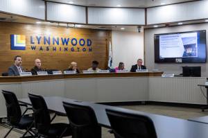 The Lynnwood City Council listens to a presentation on the development plan for the Lynnwood Event Center during a city council meeting on Oct. 13, 2025 in Lynnwood, Washington. (Olivia Vanni / The Herald)