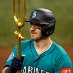 Mitch Garver (18) of the Seattle Mariners celebrates after hitting a two-run home run against the Texas Rangers during the 12th inning at Globe Life Field on June 29 in Arlington, Texas. (Ron Jenkins / Getty Images / Tribune News Services)