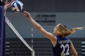 Lake Stevens’ Laura Eichert tries to tip the ball over the net during the 4A district semifinal game on Thursday, Nov. 14, 2024 in Lynnwood, Washington. (Olivia Vanni / The Herald)