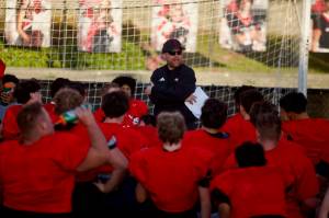 Archbishop Murphy football coach Joe Cronin addresses the team following practice at Terry Ennis Stadium on Oct. 15, 2025. (Joe Pohoryles / The Herald)
