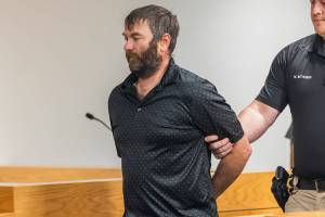 Robert Blessing is lead out of the courtroom in handcuffs after pleading guilty to three felony sex crime counts at the Snohomish County Courthouse on Oct. 23, 2025 in Everett, Washington. (Olivia Vanni / The Herald)