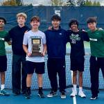 The Jackson boys tennis team poses with the District 1 4A Championship Trophy at Glacier Peak High School on Oct. 23, 2025. The team pictured left to right: Rajveer Lahankar, Andy Stark, Ashton Bergman, David Song, Arhan Sinha and Samuel Song. (Joe Pohoryles / The Herald)