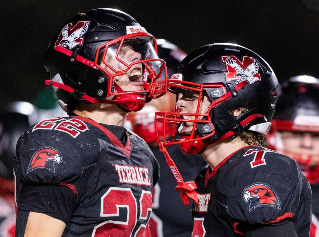 Mountlake Terraces Owen Boswell celebrates his touchdown with teammate Andrew McBride during the game against Edmonds-Woodway on Oct. 23, 2025 in Edmonds, Washington. (Olivia Vanni / The Herald)