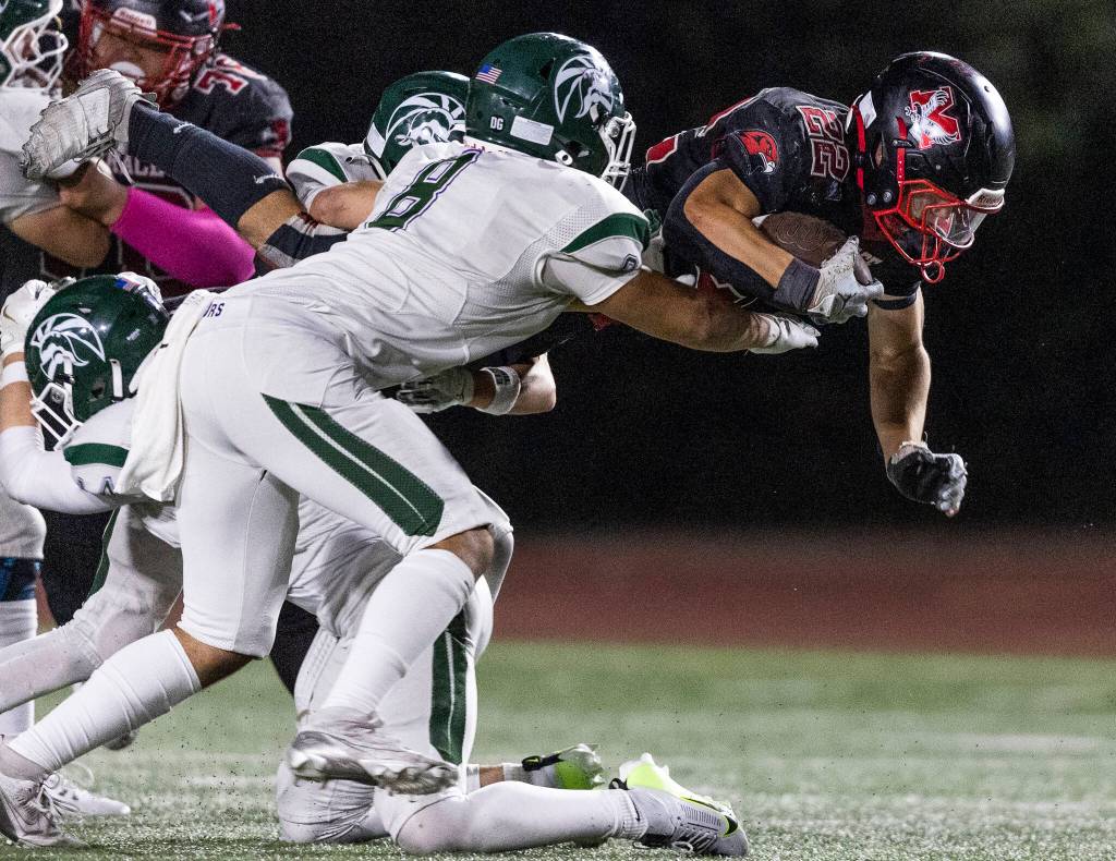 Mountlake Terraces Owen Boswell jumps to try and escape a tackle during the game against Edmonds-Woodway on Oct. 23, 2025 in Edmonds, Washington. (Olivia Vanni / The Herald)