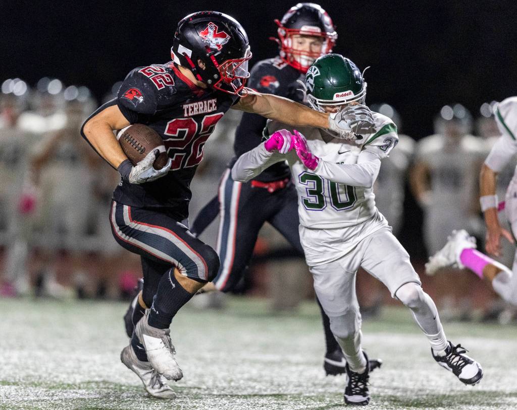 Mountlake Terraces Owen Boswell pushes Edmonds-Woodways Nicholas Stumpf as he runs the ball up the field during the game on Oct. 23, 2025 in Edmonds, Washington. (Olivia Vanni / The Herald)
