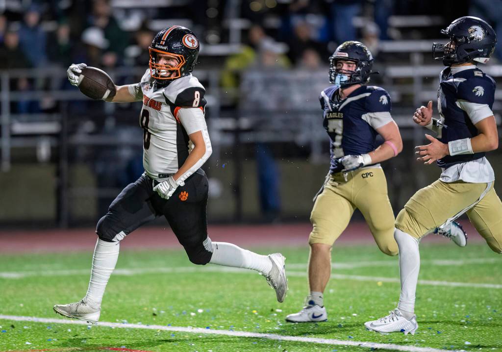 Granite Falls Drake Smith runs the ball into the end zone for a touchdown during the game against Cedar Park Christian on Oct. 24, 2025 in Kirkland, Washington. (Olivia Vanni / The Herald)