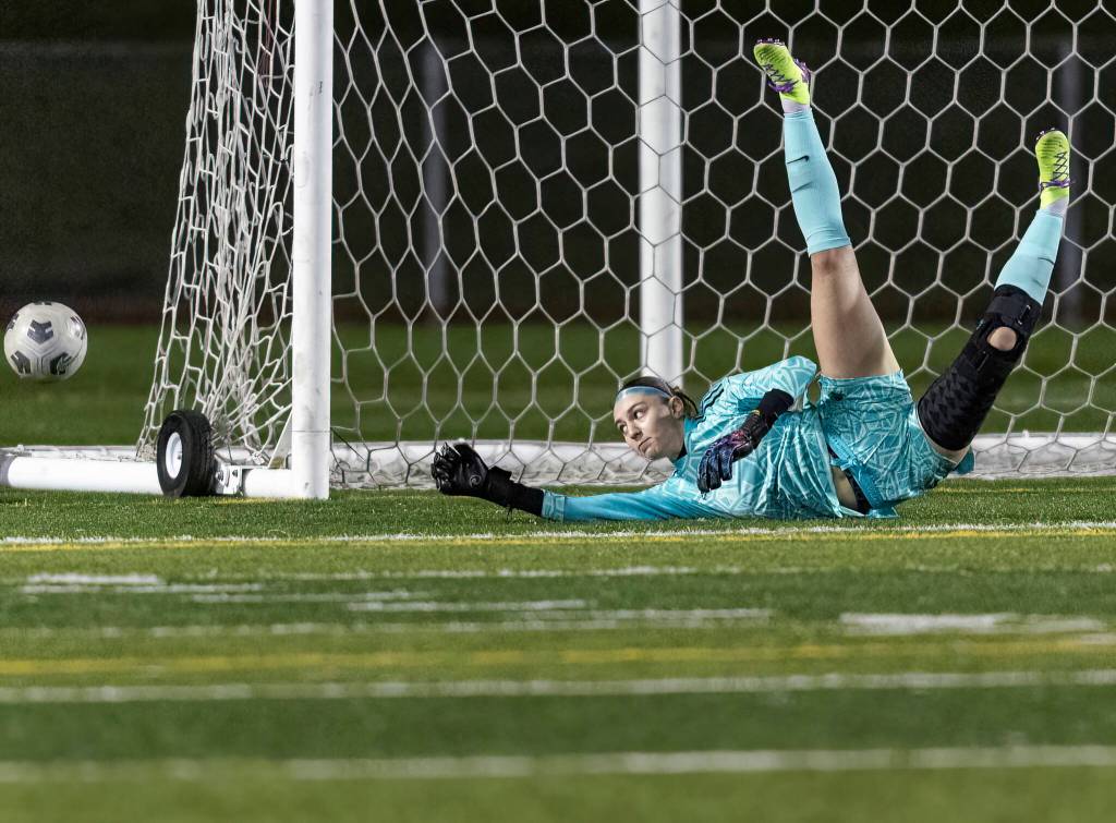 Stanwoods Bella Braley lays out to block a shot during the game against Snohomish on Oct. 27, 2025 in Snohomish, Washington. (Olivia Vanni / The Herald)