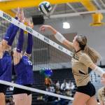Lynnwoods Evelyn Hall spikes the ball over the net during the game against Edmonds-Woodway on Oct. 29, 2025 in Edmonds, Washington. (Olivia Vanni / The Herald)