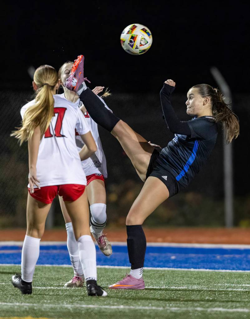 Shorewoods Sky Helstad reaches her leg up to kick the ball during the 3A district game against Mountlake Terrace on Oct. 30, 2025 in Shoreline, Washington. (Olivia Vanni / The Herald)