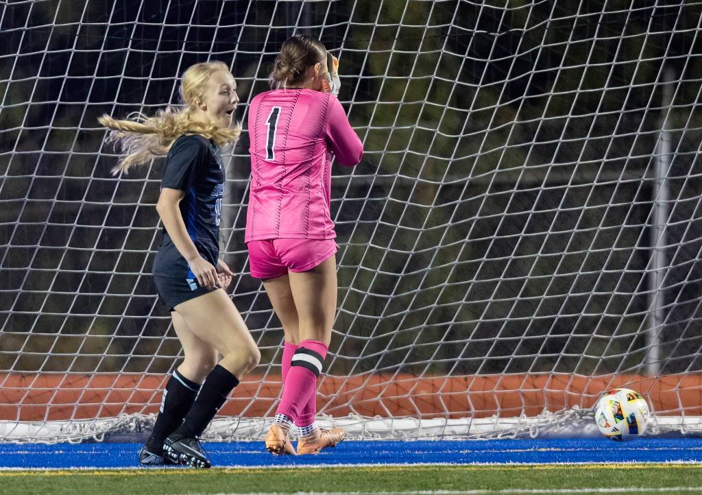 Shorewoods Siena Lorentz reacts to scoring a goal on Mountlake Terraces Jordyn Stokes during the 3A district game on Oct. 30, 2025 in Shoreline, Washington. (Olivia Vanni / The Herald)