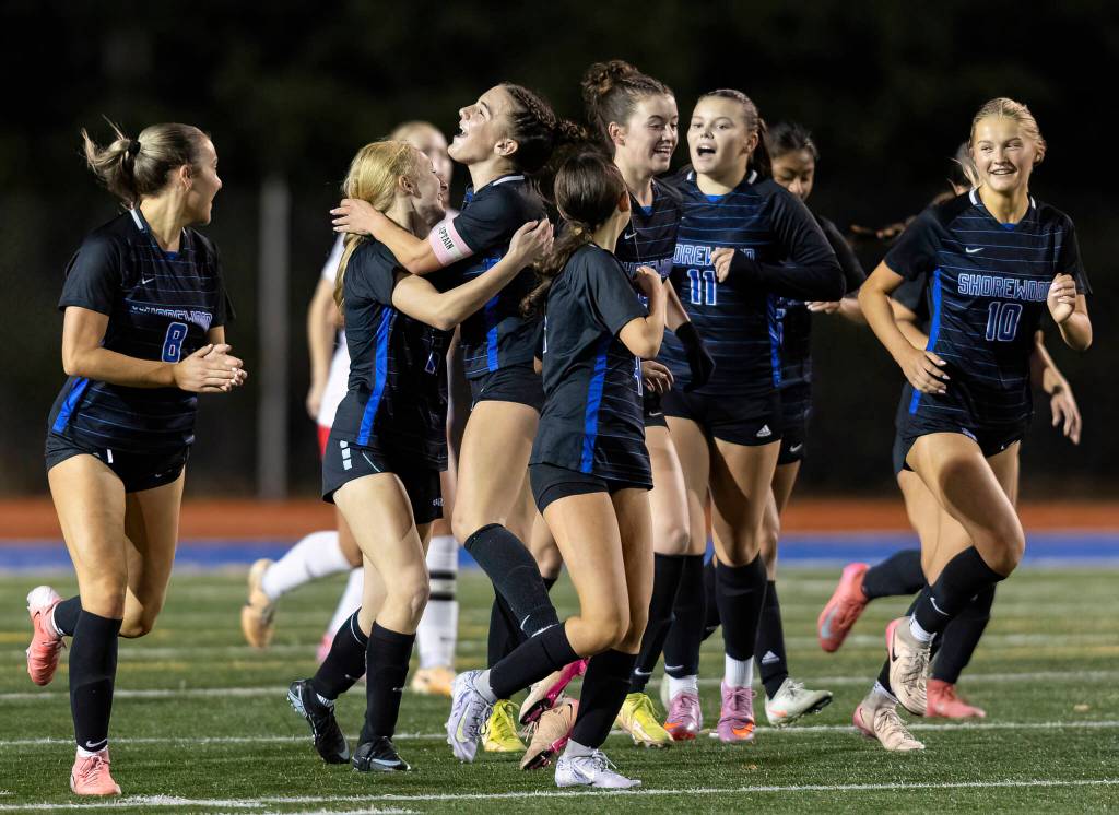 Shorewood players celebrate scoring against Mountlake Terrace during the 3A district game on Oct. 30, 2025 in Shoreline, Washington. (Olivia Vanni / The Herald)