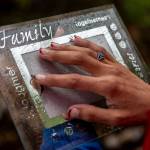 Gerry Davis holds an empty picture frame, which she intended to put a photo of her sister Mary at Hillcrest Park in Mount Vernon, Washington on Wednesday, May 29, 2024. (Annie Barker / The Herald)