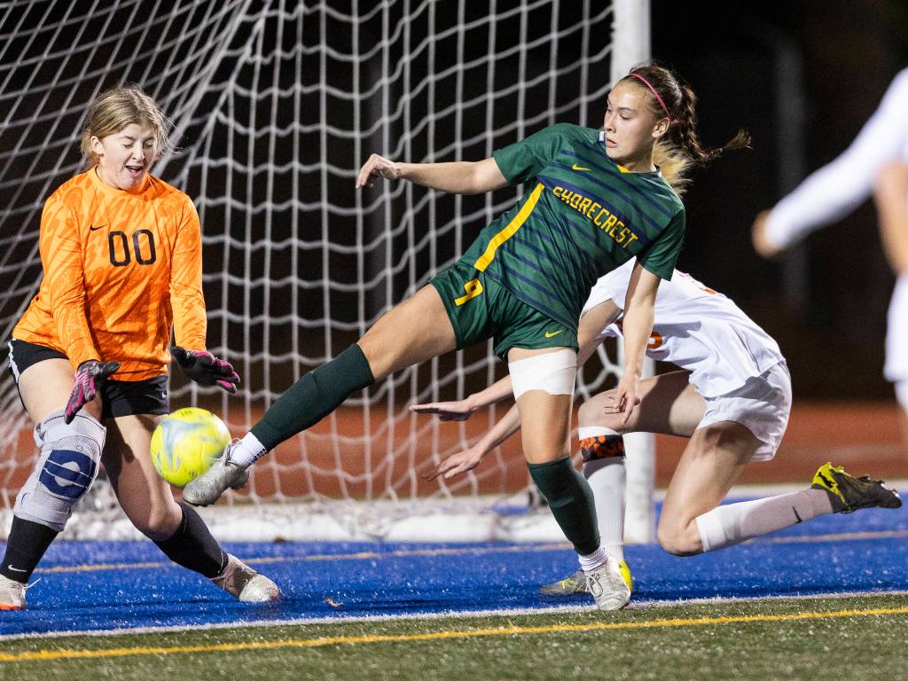 Shorecrests Olivia Taylor takes a shot on goal against Monroes Brooke Parkinson during the 3A girls district game on Nov. 4, 2025 in Shoreline, Washington. (Olivia Vanni / The Herald)