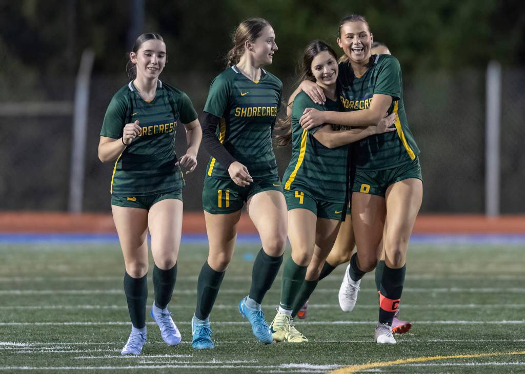 Shorecrests Ava Sasnett is hugged by teammates after scoring a goal against Monroe during the 3A girls district game on Nov. 4, 2025 in Shoreline, Washington. (Olivia Vanni / The Herald)