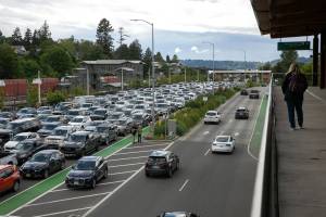 Vehicles pack the line for the Mukilteo-Clinton ferry as they wait to board on Wednesday, May 29, 2024, in Mukilteo, Washington. (Ryan Berry / The Herald)