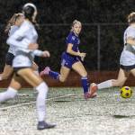 Lake Stevens Shelby Clifton dribbles the ball upfield while Jackson defends during the 4A girls district game on Nov. 5, 2025 in Lake Stevens, Washington. (Olivia Vanni / The Herald)