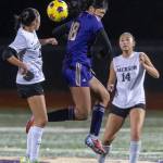 Lake Stevens Noelani Tupua jumps up to head the ball during the 4A girls district game against Jackson on Nov. 5, 2025 in Lake Stevens, Washington. (Olivia Vanni / The Herald)