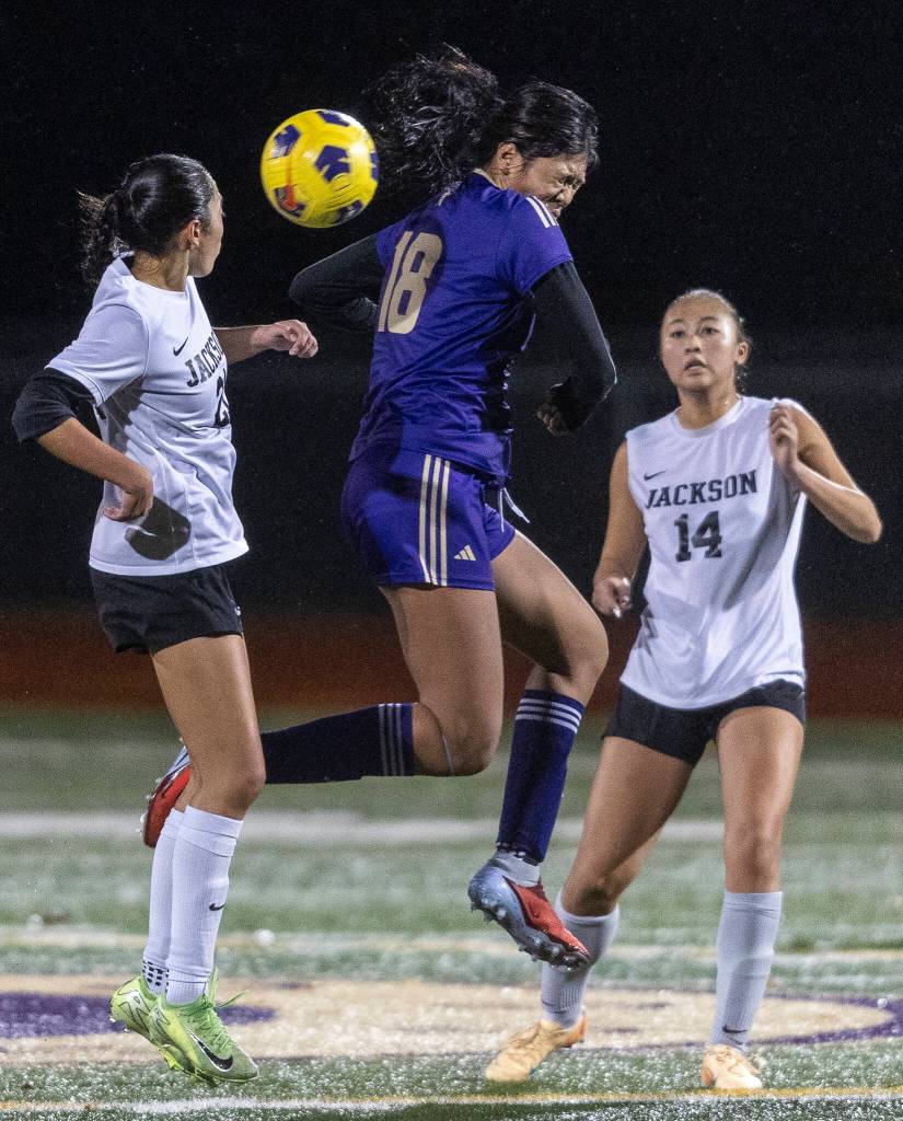 Lake Stevens Noelani Tupua jumps up to head the ball during the 4A girls district game against Jackson on Nov. 5, 2025 in Lake Stevens, Washington. (Olivia Vanni / The Herald)