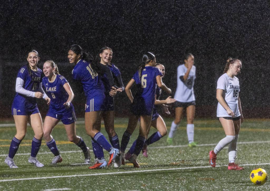 Lake Stevens Cora Jones celebrates her goal with teammates during the 4A girls district game against Jackson on Nov. 5, 2025 in Lake Stevens, Washington. (Olivia Vanni / The Herald)