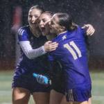 Lake Stevens Tessa Anastasi celebrates beating Jackson with Sami Heininger and Judith Roehl after the 4A girls district game on Nov. 5, 2025 in Lake Stevens, Washington. (Olivia Vanni / The Herald)