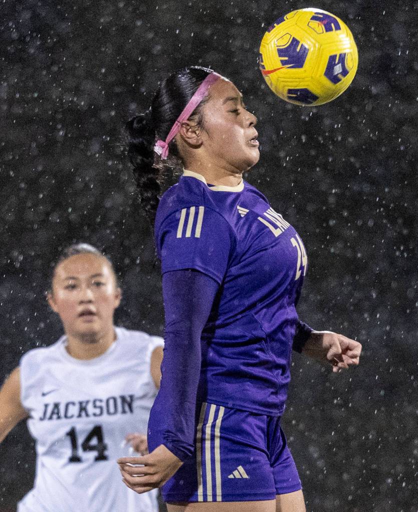 Lake Stevens Keira Isabelle Tupua heads the ball during the 4A girls district game against Jackson on Nov. 5, 2025 in Lake Stevens, Washington. (Olivia Vanni / The Herald)