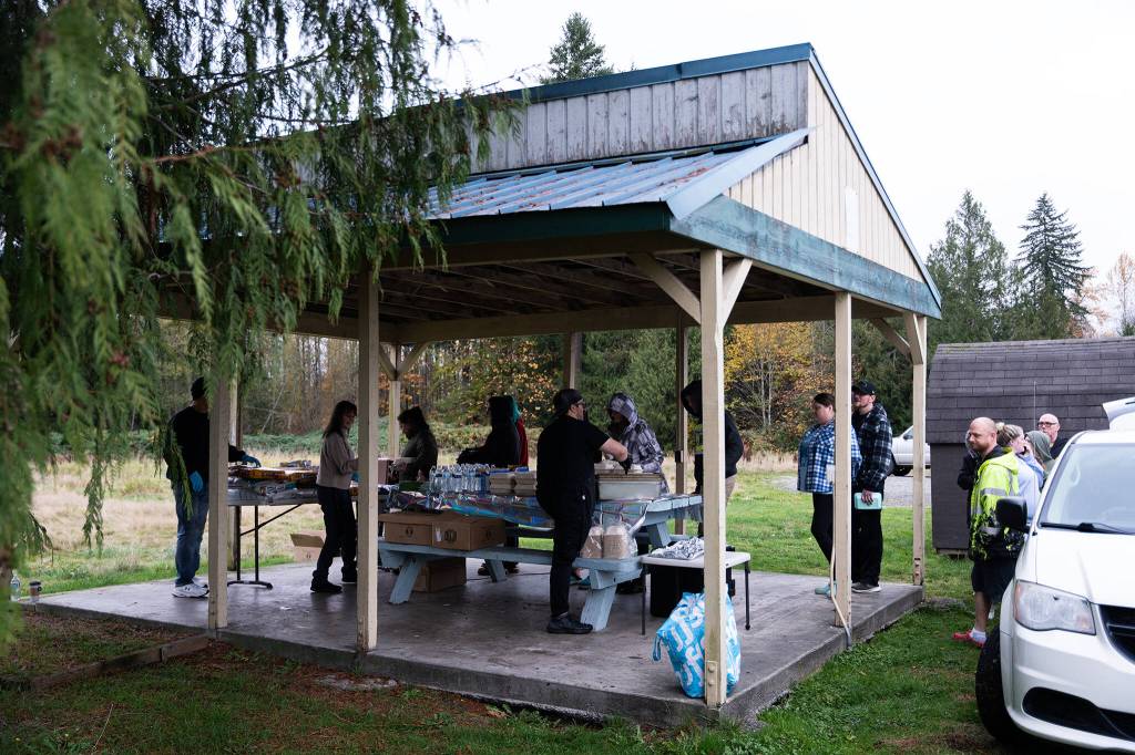 Community members receive hot food on Monday in Granite Falls.