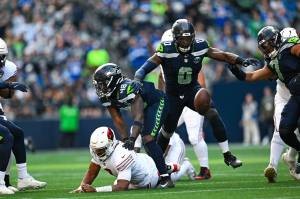 Seahawks linebacker DeMarcus Lawrence (0) prepares to recover a fumble forced by linebacker Tyrice Knight (0) in Seattles 44-22 win over the Arizona Cardinals on Sunday, Nov. 9, 2025 at Lumen Field in Seattle, Washington. (Photo courtesy of the Seattle Seahawks)