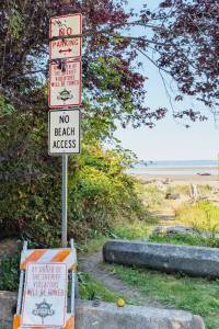 No Beach Access and By Order of the Sheriff tow-away signs installed at Hillman Place a public right-of-way near Soundview Drive Northwest in Stanwood. (Kallen Specht)