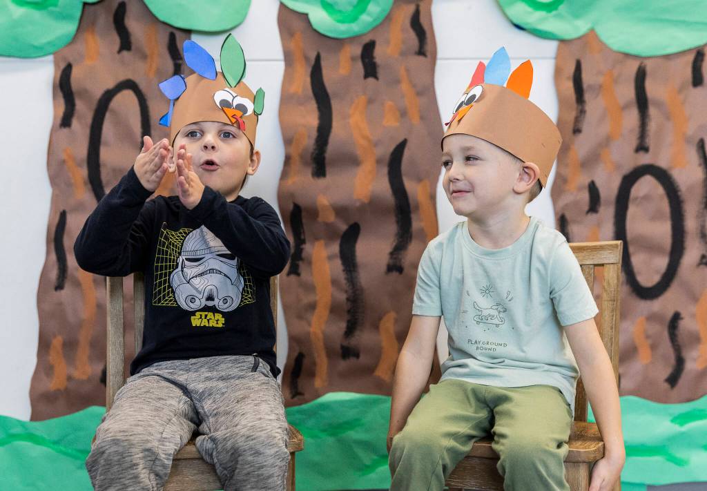 Stevens Creek kindergarteners Rowen Holme, 5, left, and Chase McMail, 6, answer how much food they eat on Thanksgiving on Nov. 20, 2025 in Lake Stevens, Washington. (Olivia Vanni / The Herald)