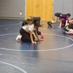 The Kamiak girls wrestling team engages in drills during their first-ever practice separate from the boys team at Kamiak High School on Nov. 17, 2025. (Joe Pohoryles / The Herald)