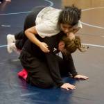 Kamiak sophomore Navami Nambiar (wearing white) and junior Lillian Burgess participate in spin drills during the first girls wrestling practice of the season at Kamiak High School on Nov. 17, 2025. (Joe Pohoryles / The Herald)