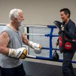 Gary Goltz hits mitts in the ring with Dakota Stones encouragement during a class at Solid Stone Boxing Gym for people with Parkinsons disease.