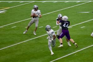 Glacier Peak sophomore Oliver Setterberg (11) looks downfield for a pass during the Grizzlies' 34-17 loss to Sumner in the WIAA 4A State quarterfinals at Sumner Chev Stadium on Nov. 22, 2025. (Joe Pohoryles / The Herald)