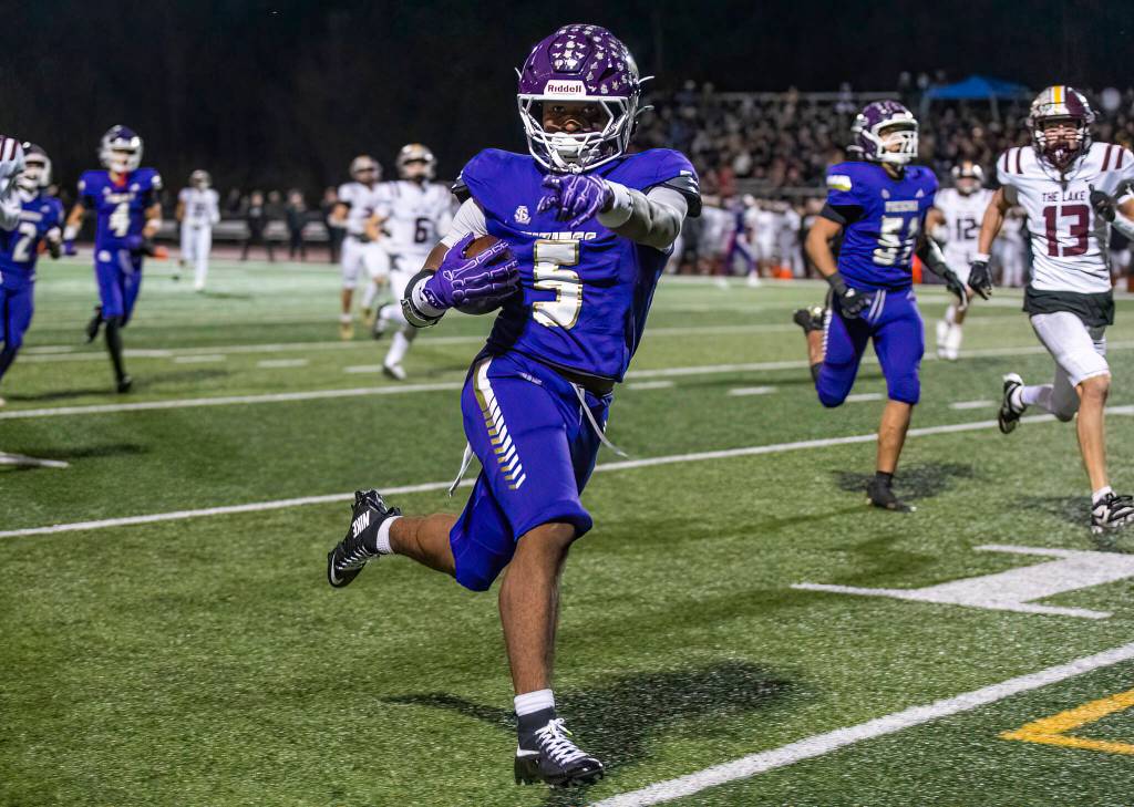 Lake Stevens Jayvian Ferrell runs the ball into the end zone for a touchdown during the 4A state football quarterfinal game against Moses Lake on Nov. 22, 2025 in Lake Stevens, Washington. (Olivia Vanni / The Herald)