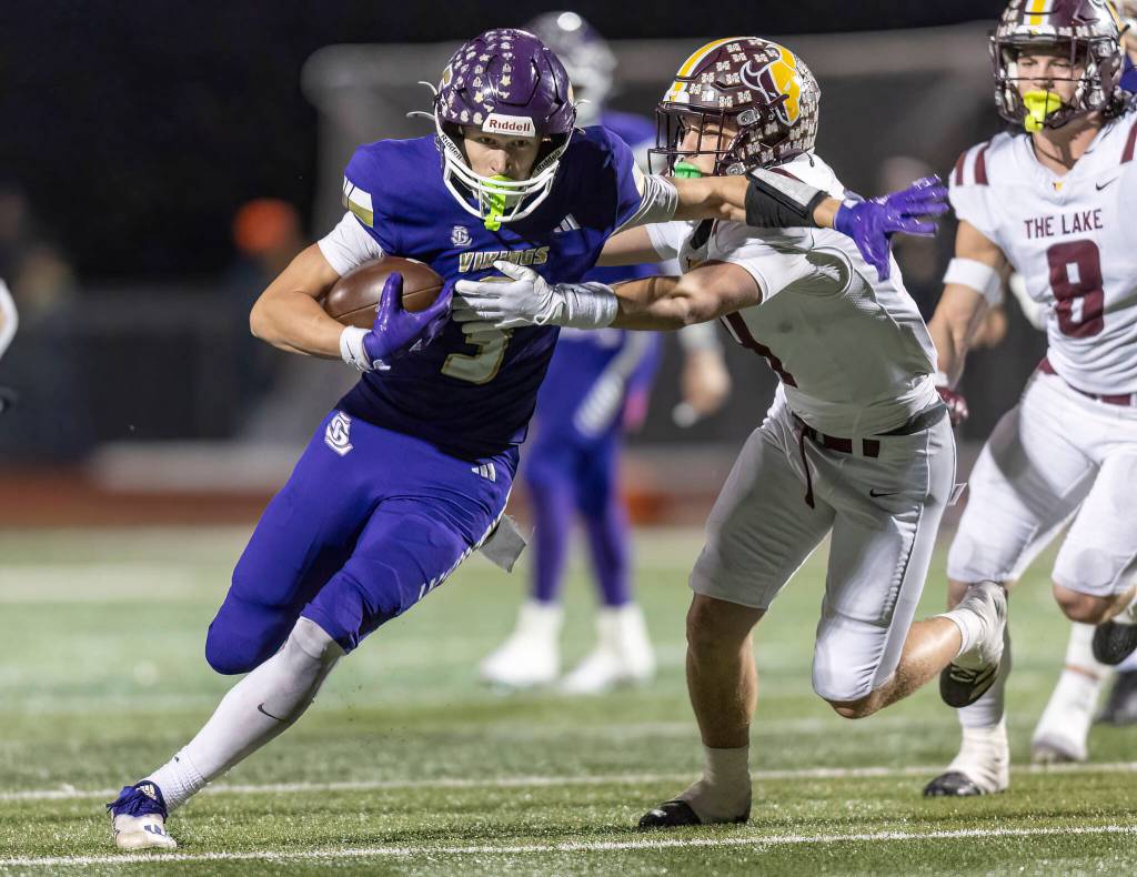 Lake Stevens Max Cook escapes a tackle during the 4A state football quarterfinal game against Moses Lake on Nov. 22, 2025 in Lake Stevens, Washington. (Olivia Vanni / The Herald)