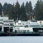 The state ferries Klahowya (center right) and Hyak (left center) are taking up valuable space at the Eagle Harbor maintenance yard of Washington State Ferries. Both retired ferries have been for sale for more than four years. (Photo by Tom Banse for Washington State Standard)