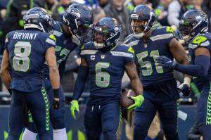 Seattle Seahawks safety Quandre Diggs (6) celebrates his interception with teammates during the first half against the Las Vegas Raiders at Lumen Field on Sunday, Nov. 27, 2022, in Seattle. (Heidi Fang / Las Vegas Review-Journal / Tribune News Services)