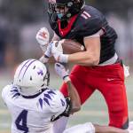 Archbishop Murphys Henry Gabalis shakes off a tackle during the 2A state football semifinal game against Anacortes on Nov. 29, 2025 in Everett, Washington. (Olivia Vanni / The Herald)