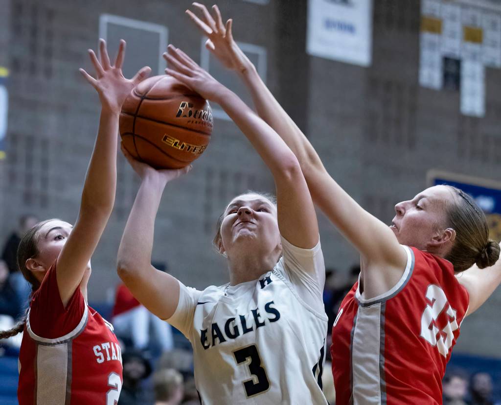 Arlingtons Basia Pszonka has her shot blocked during the game against Stanwood on Dec. 3, 2025 in Arlington, Washington. (Olivia Vanni / The Herald)