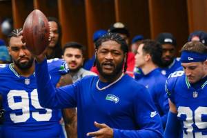 Seattle Seahawks linebacker Ernest Jones IV addresses his teammates after being awarded a game ball following a 26-0 win over the Minnesota Vikings at Lumen Field in Seattle, Washington on Sunday, Nov. 30, 2025. (Photo courtesy of the Seattle Seahawks)