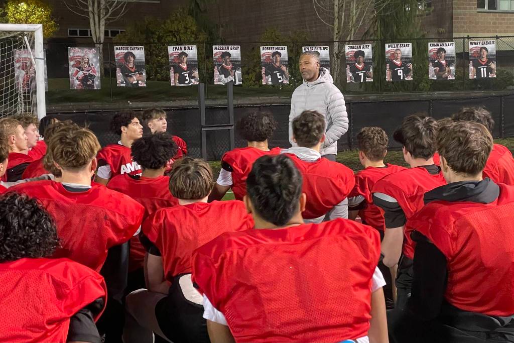 Lawyer Milloy, a former NFL All-Pro safety who played at the University of Washington, addresses the Archbishop Murphy football team on Tuesday, Dec. 2, 2025 at Terry Ennis Field in Everett, Washington. (Aaron Coe / The Herald)
