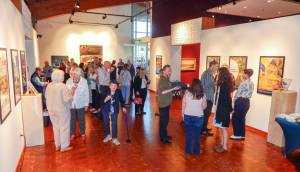 Cascadia visitors mingle among the art during its 10th anniversary celebration, on Sept. 12, in Edmonds, Wash. (Jon Bauer / The Herald)