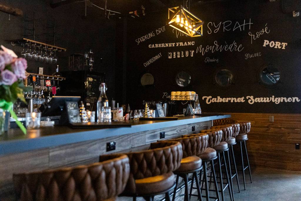 The bar counter inside the Rustic Cork Wine Bar at the Port of Everett on Dec. 2, 2025 in Everett, Washington. (Olivia Vanni / The Herald)