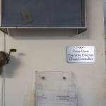 A nameplate declaring Casey Davis as the chaos controller is visible outside of her small makeshift office space at the Edmonds Food Bank on Dec. 8, 2025, in Edmonds, Washington. (Olivia Vanni / The Herald)