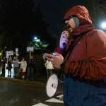 Phoenix Horn leads chants during a rally outside of the Edmonds School District building on Tuesday, Dec. 9, 2025, in Edmonds, Washington. (Olivia Vanni / The Herald)
