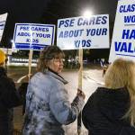 Diane Grossenbacher, an office manger at Lynndale Elementary School, rallys outside of the Edmonds School District building before a meeting to push for the district for a contract on Tuesday, Dec. 9, 2025 in Edmonds, Washington. (Olivia Vanni / The Herald)